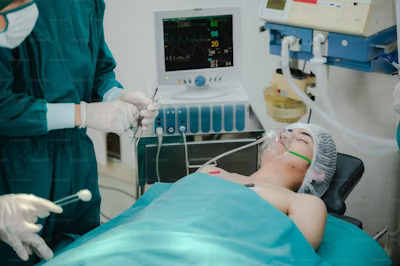  a nurse tending to a critically ill patient in the ICU